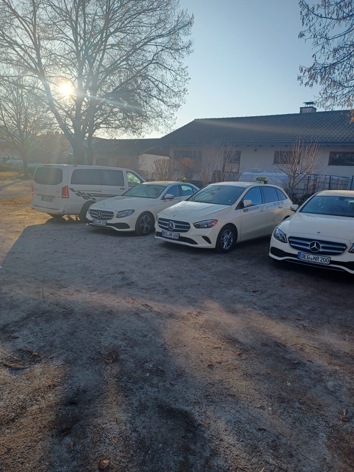 Four taxis and a people carrier of Taxi Neumeier on the company yard in Deggendorf